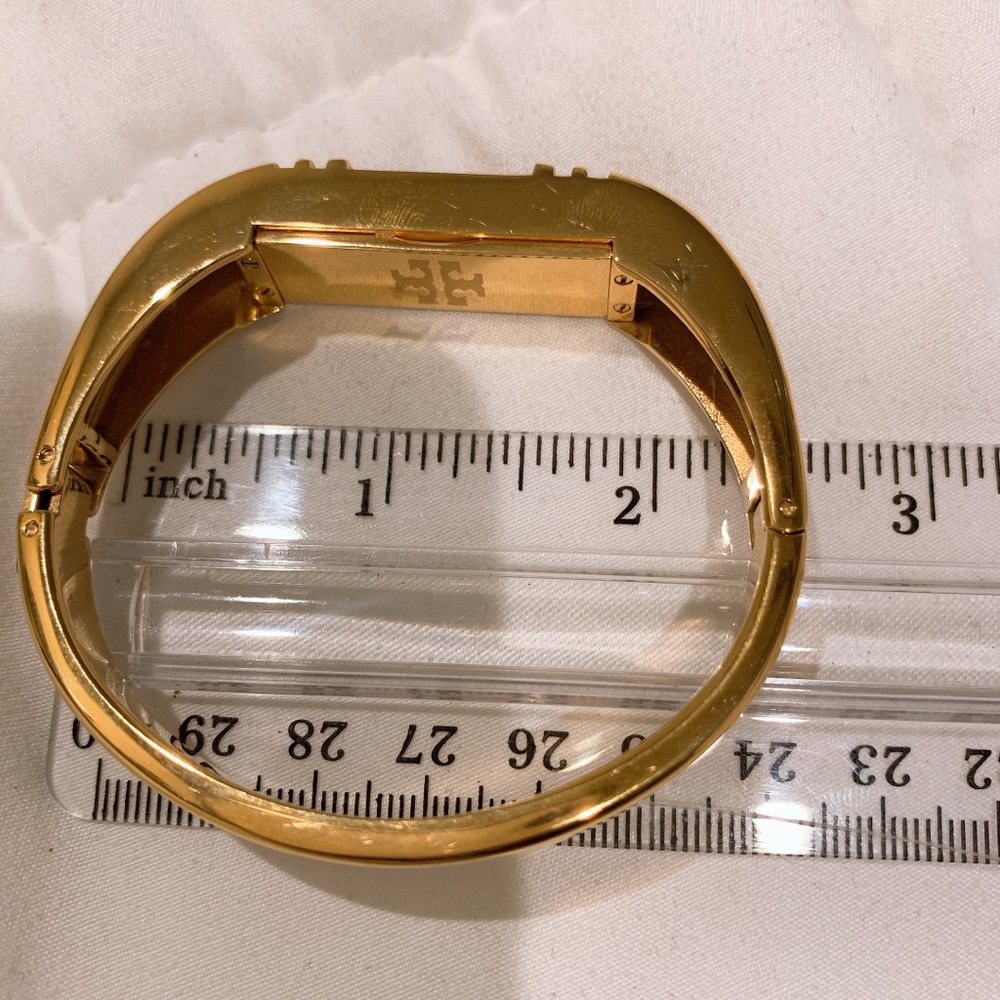 Tory Burch fitbit wristlet , gold .